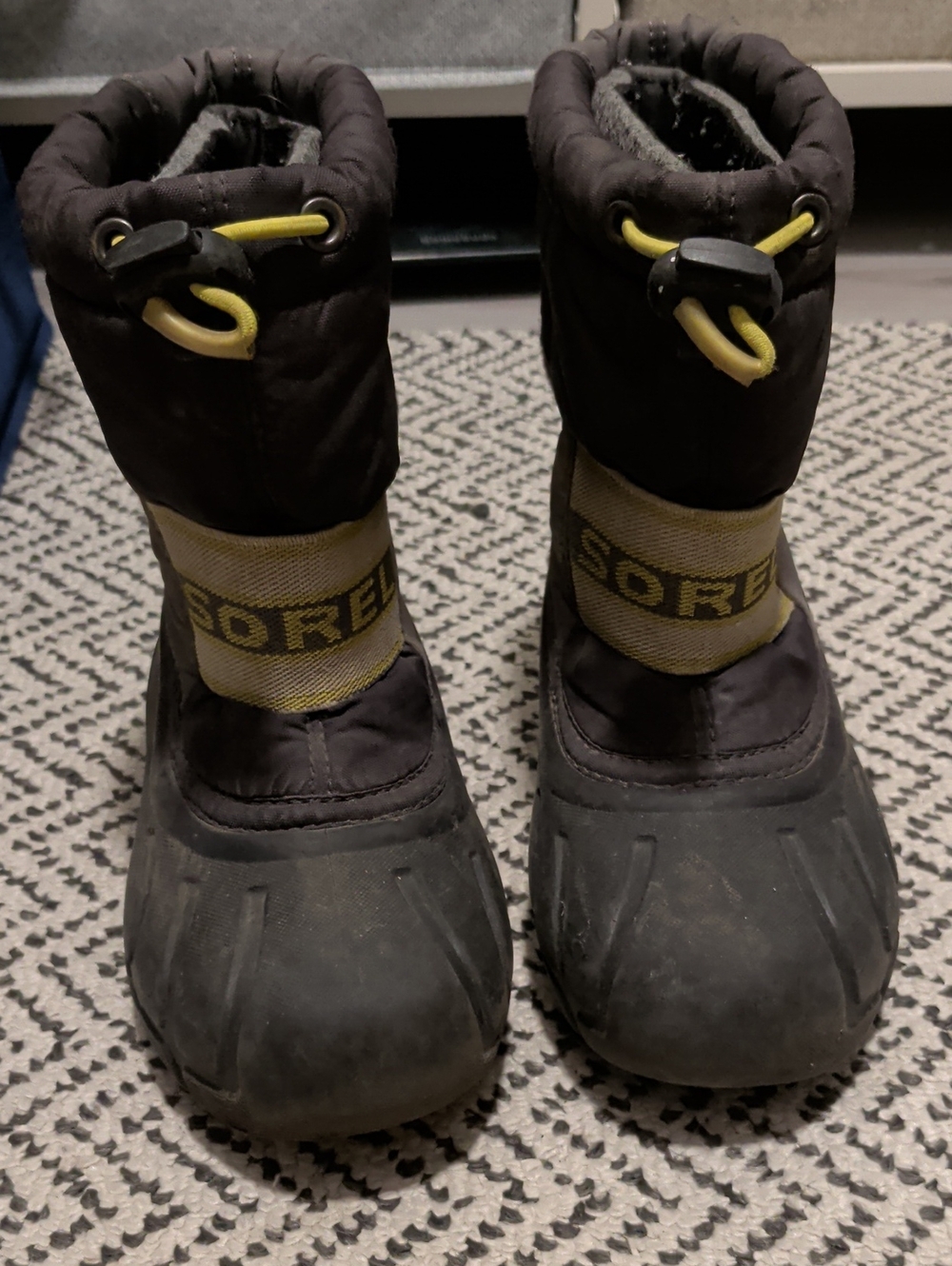 Sorel Kids Black Boots with Yellow Accents